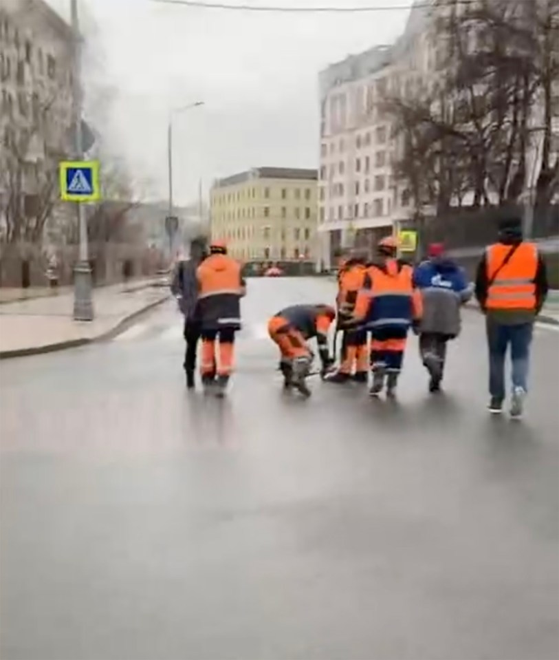 Workers inspecting sewers in Moscow.