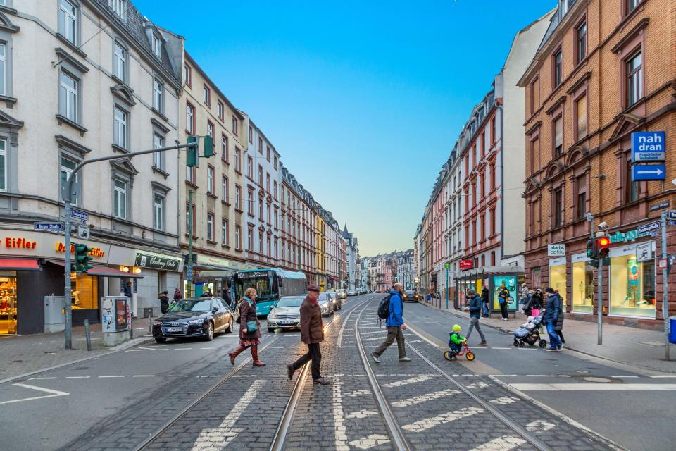 People crossing a street in Bornheim, Frankfurt, Germany.