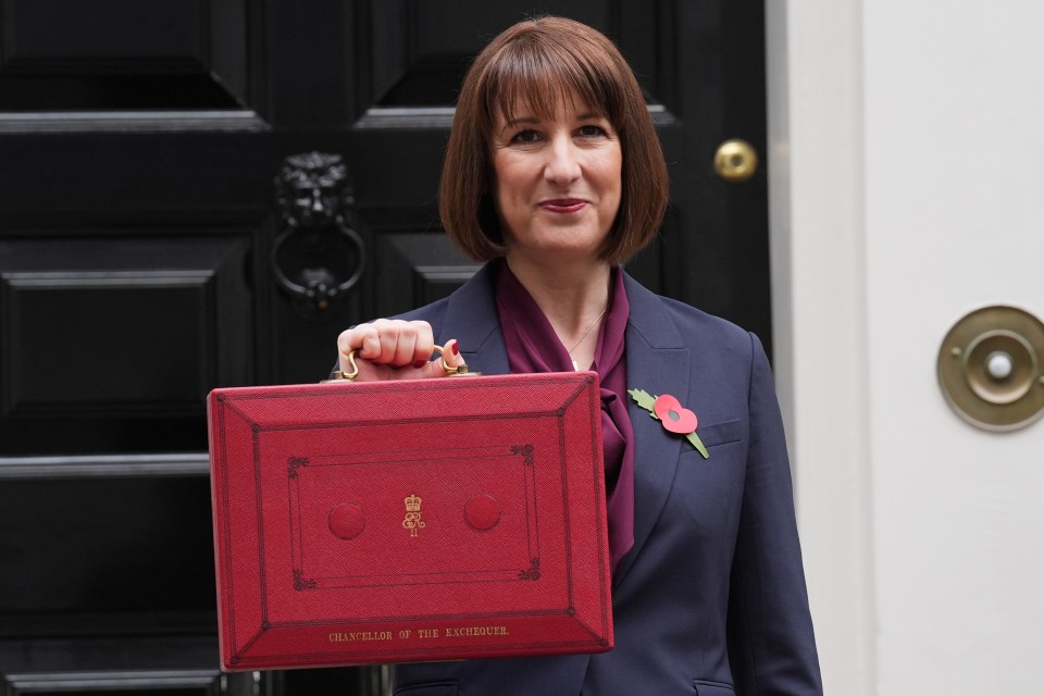 Rachel Reeves, Chancellor of the Exchequer, holding her red budget box outside 11 Downing Street.