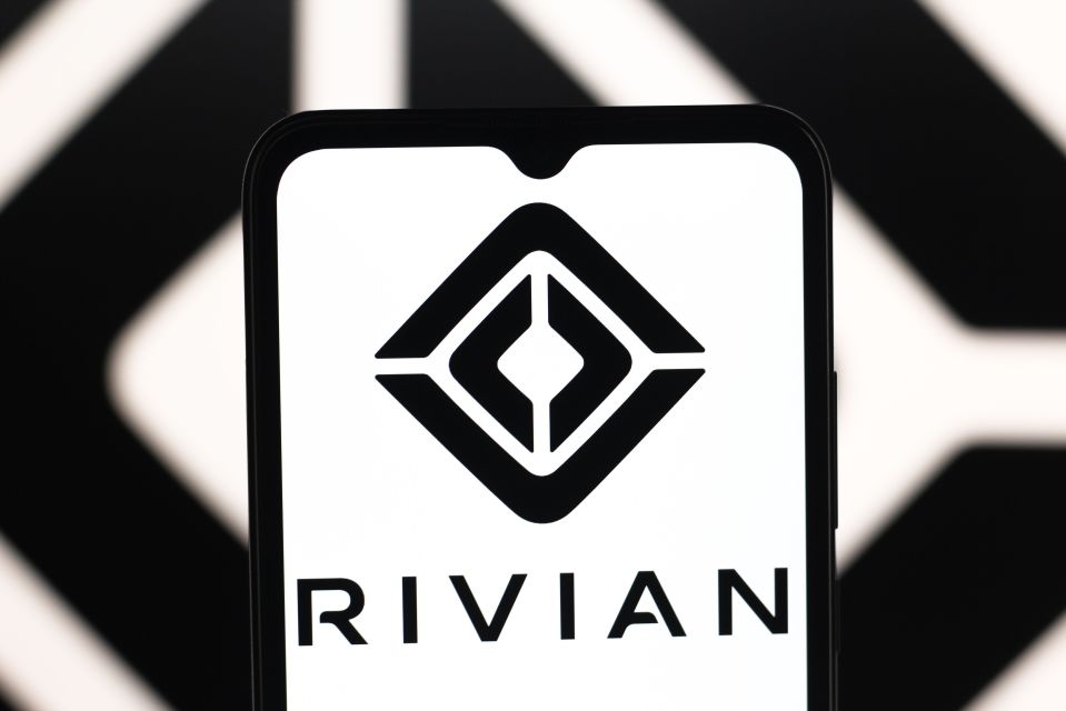 Illustration of the Rivian Automotive logo on a smartphone screen.