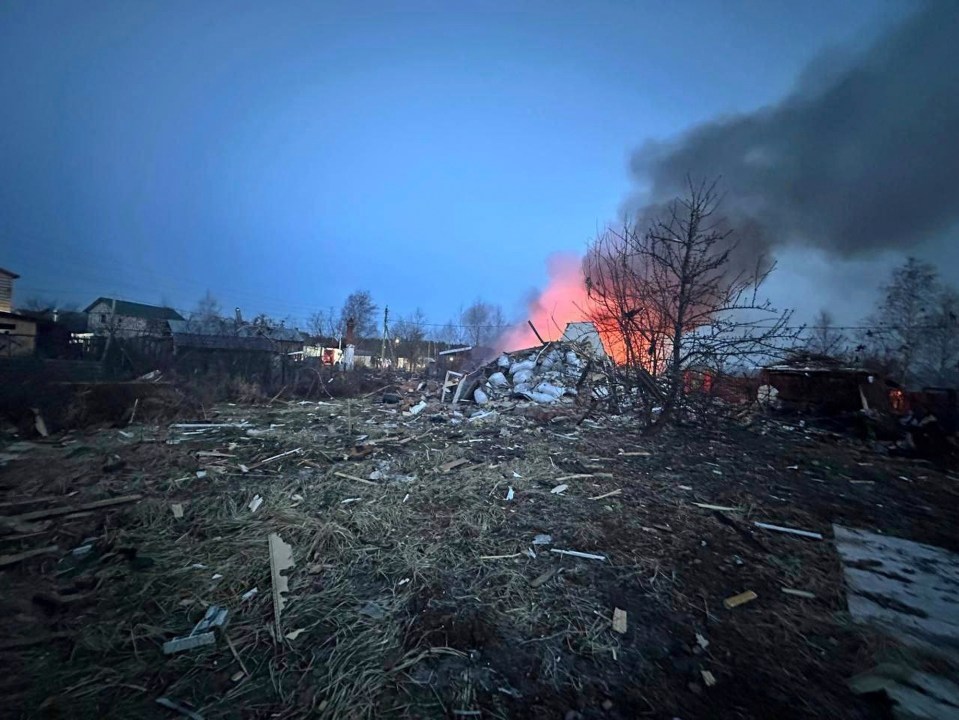 Debris field and burning building after a drone strike.