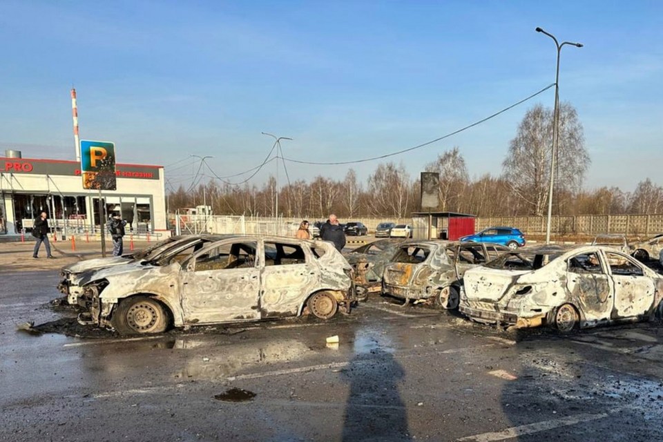 Burned cars in a parking lot after a drone attack.