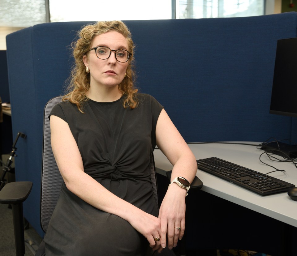 Tamsin McNally, hotline manager, at her desk.