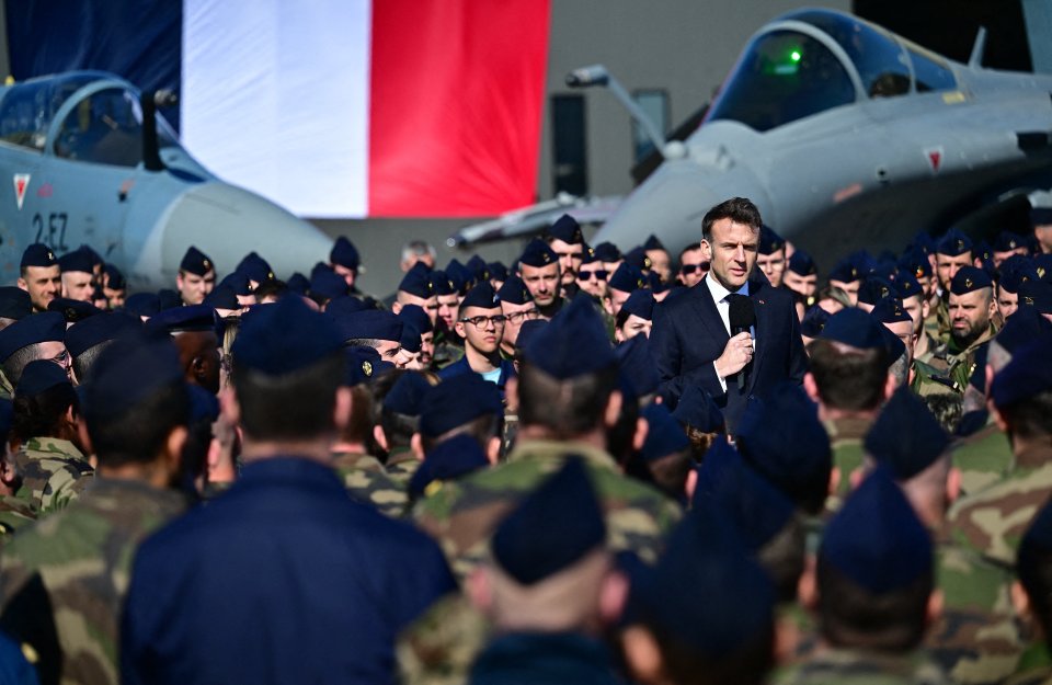 President Macron addressing French soldiers at an air base.