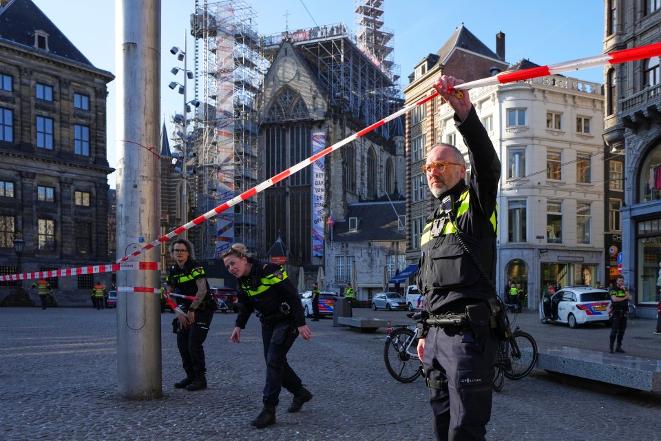 Police officers cordoning off an area in Amsterdam.