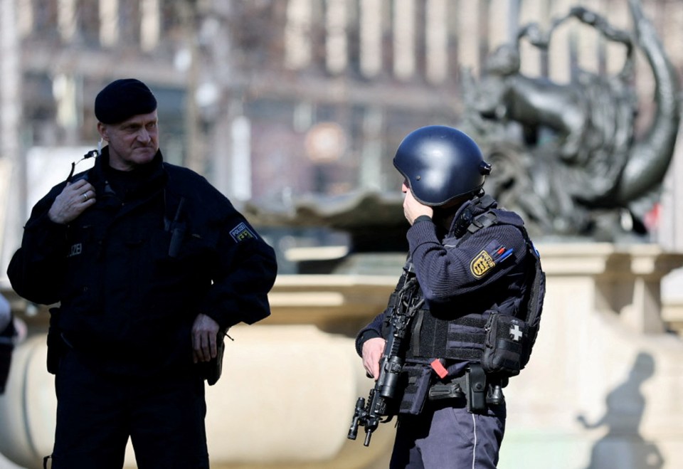 Two police officers at a crime scene.