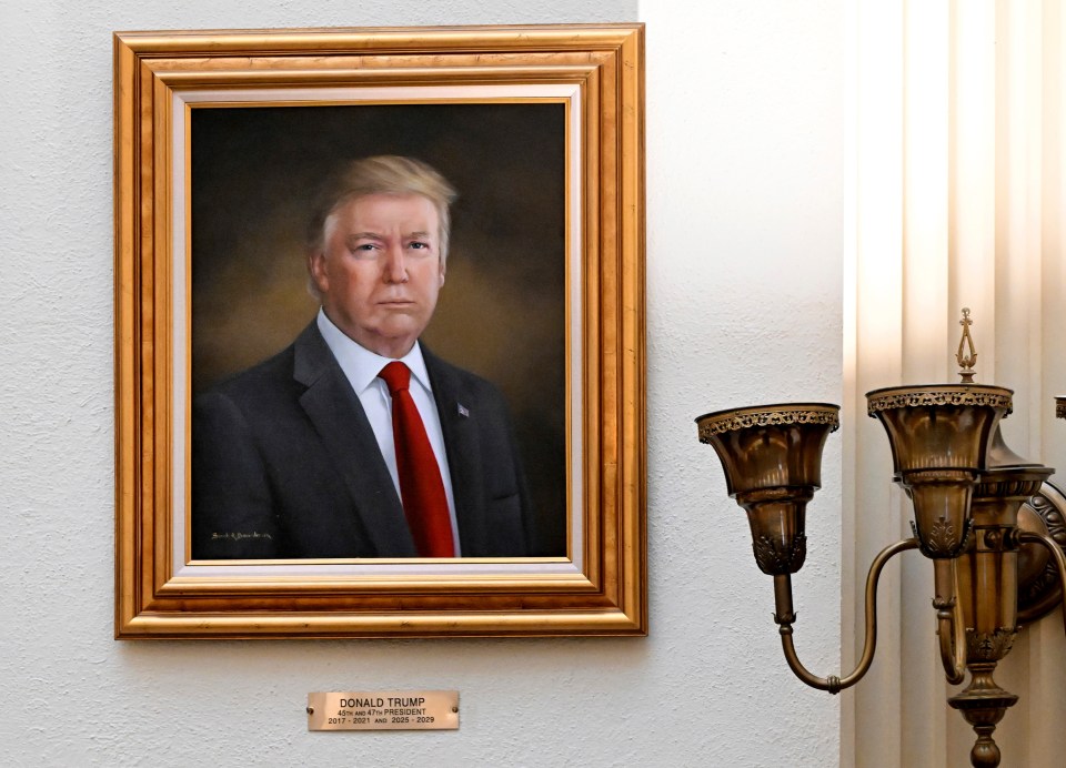 Portrait of Donald Trump in a gold frame.