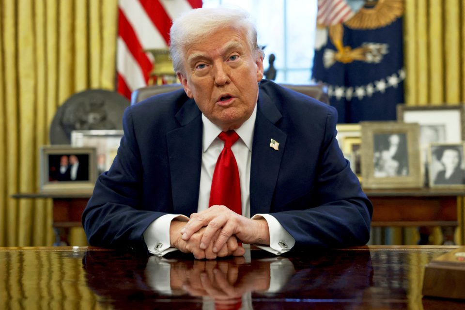 President Donald Trump speaking to reporters in the Oval Office.