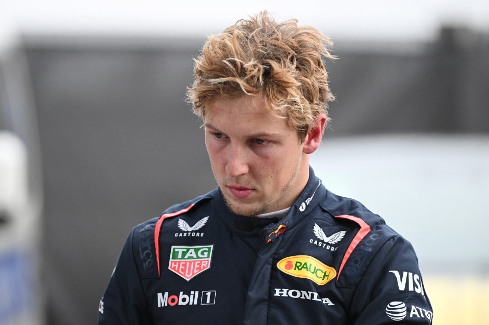 Liam Lawson, Red Bull Racing driver, walking back to his garage.