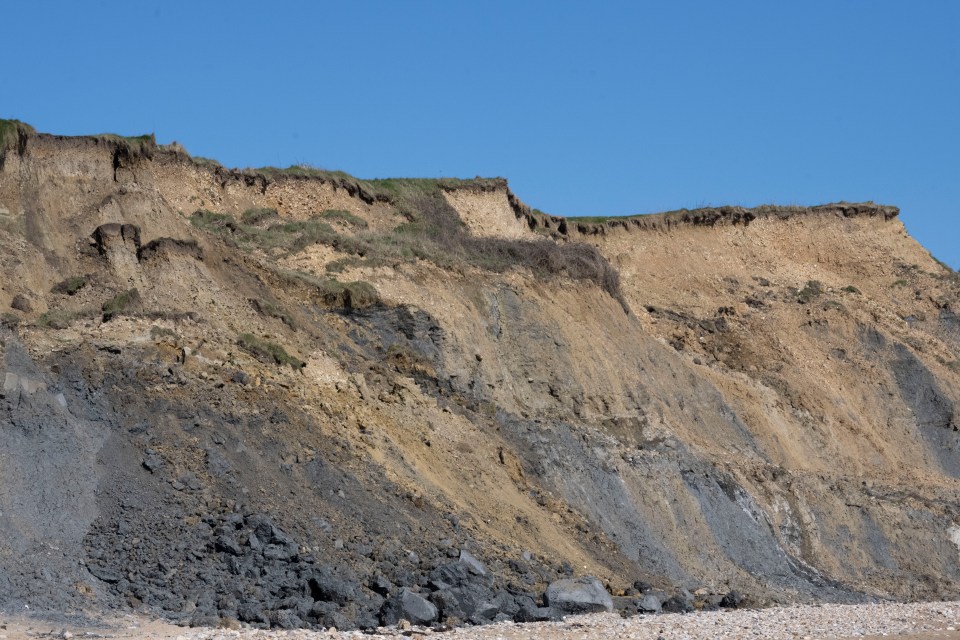Rockfall debris at the base of a cliff.
