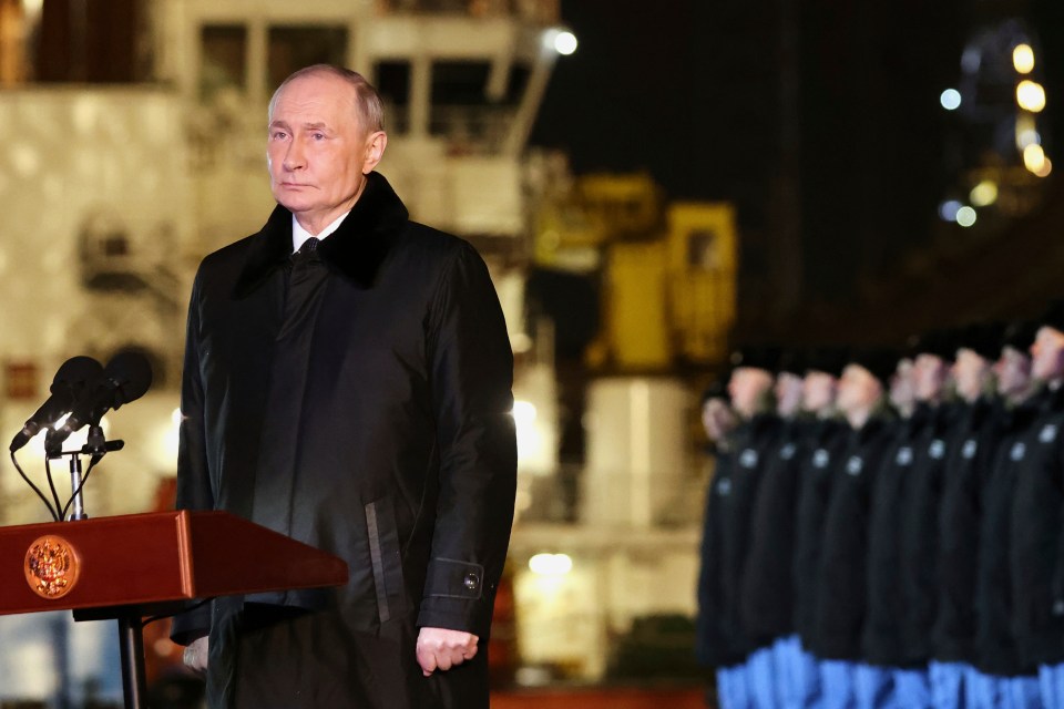 Vladimir Putin speaking at a podium.