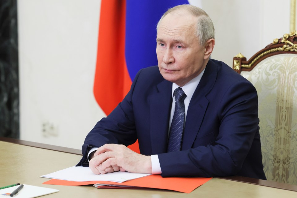Vladimir Putin chairing a meeting.
