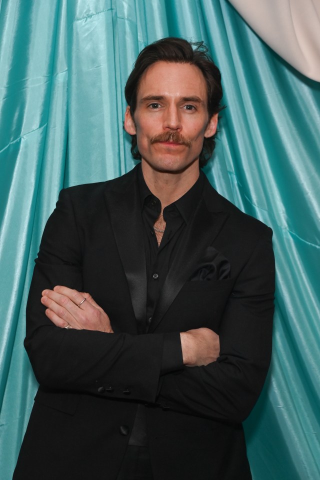 Sam Claflin at a fashion and film event.