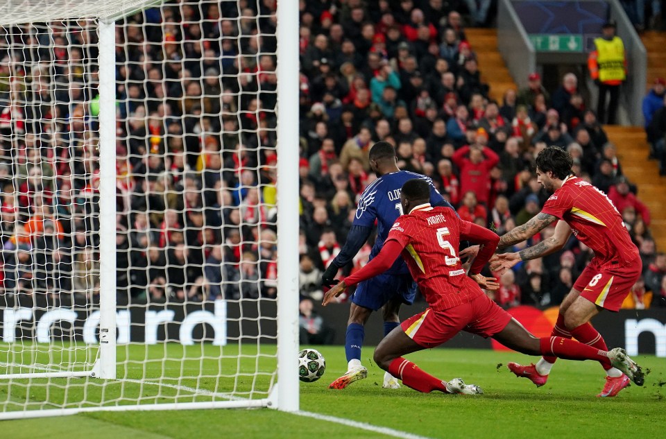 Soccer player scoring a goal.