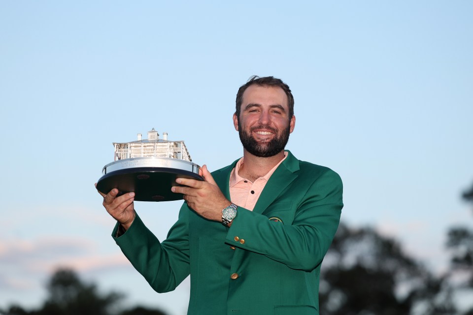 Scottie Scheffler holding the Masters trophy.
