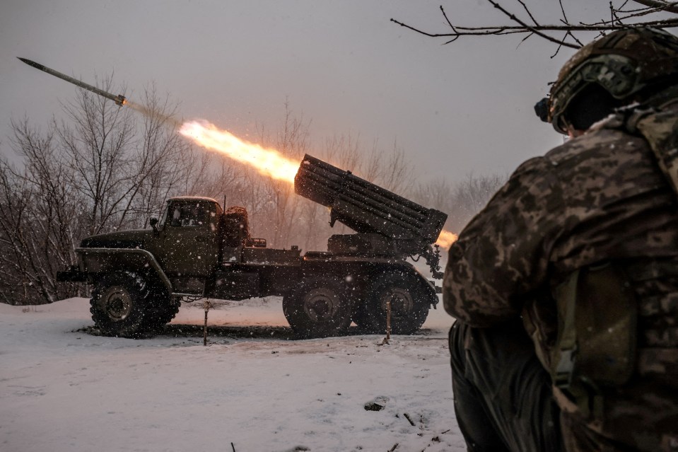 Ukrainian soldier firing a BM-21 Grad multiple-launch rocket system.
