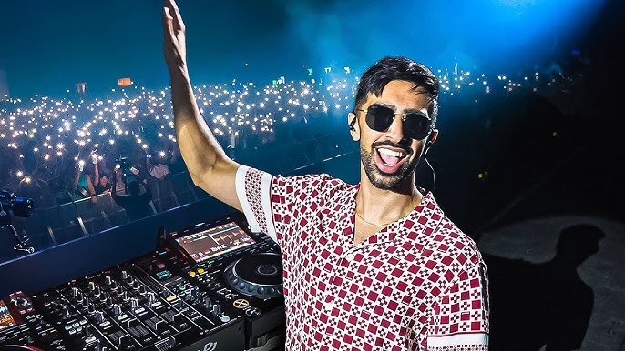Vikkkstar DJ performing at a concert.