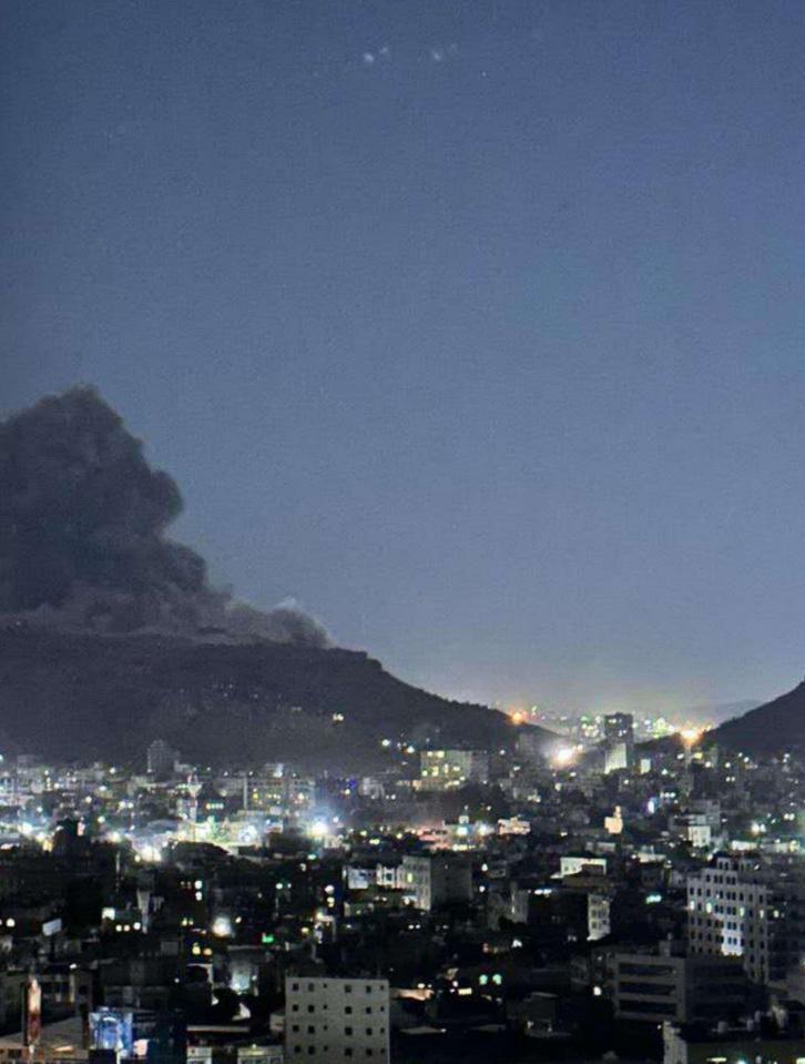 Smoke rising over Sanaa, Yemen, at night after an airstrike.