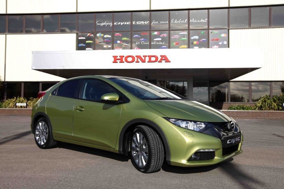 Green Honda Civic at Honda factory.