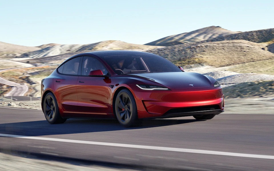 Tesla Model 3 Long Range driving on a road.