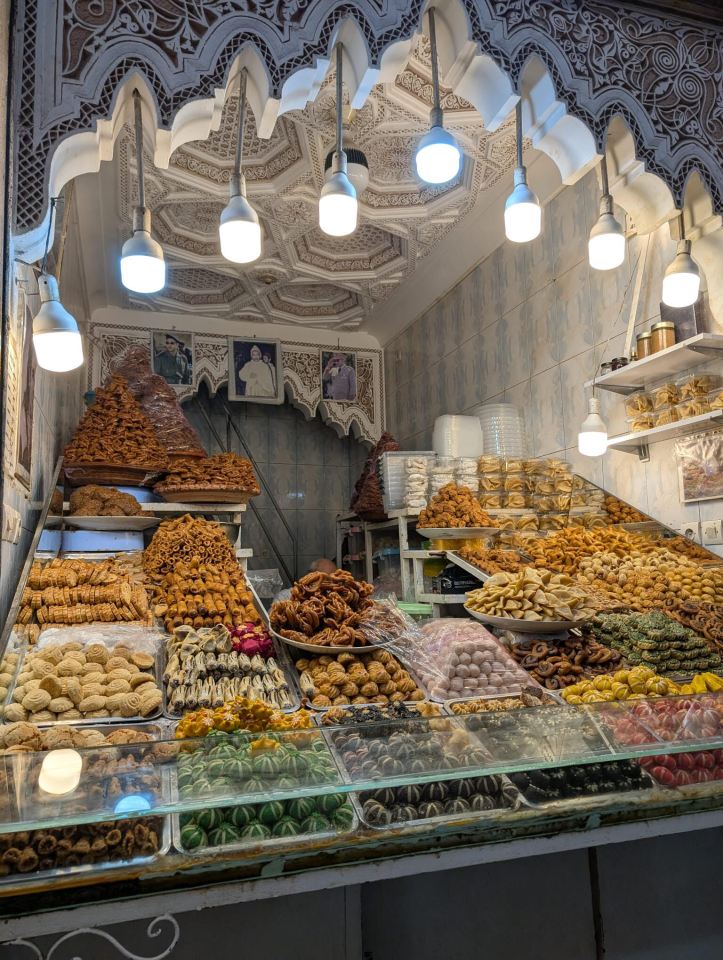 A display case filled with various pastries and sweets.