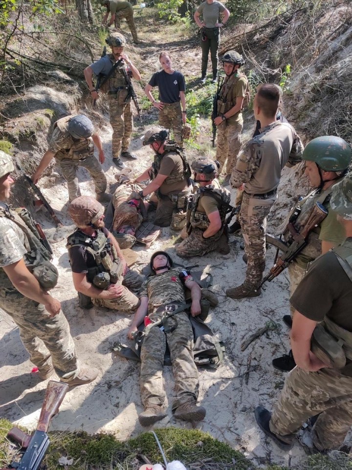 Ukrainian frontline medics treating a wounded soldier while under surveillance by Russian drones.