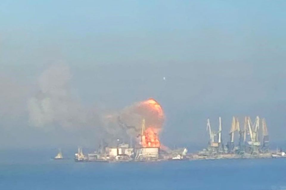 Photo of a large explosion and fire at a port.