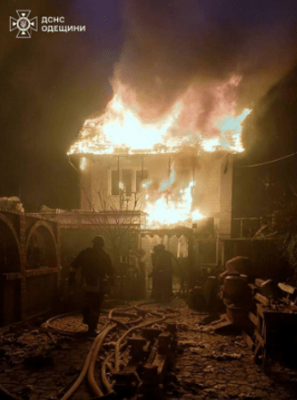 Firefighters battling a house fire.