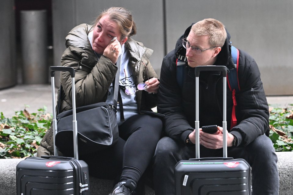 Upset couple at Heathrow Airport after a power outage.