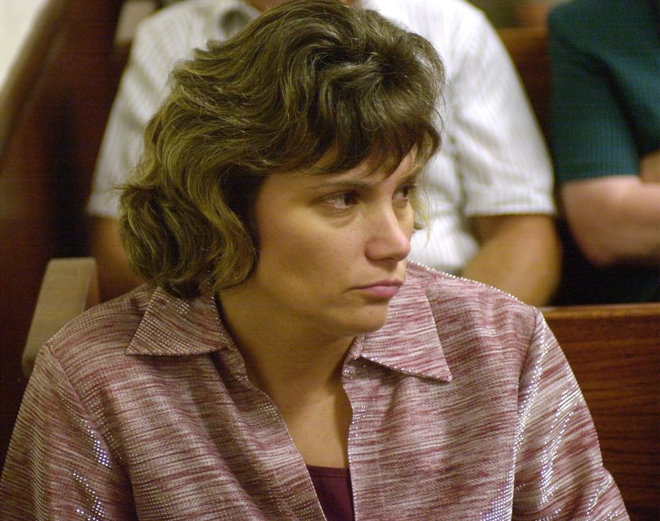 Rebecca Barbare, now Rebecca Armstrong, watching attorneys discuss testimony.