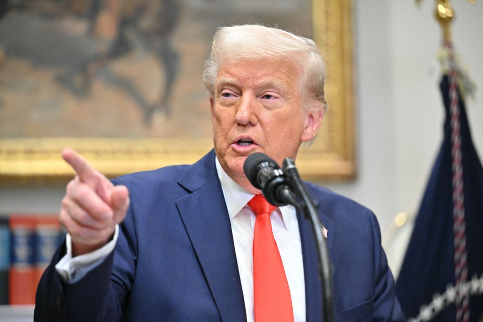 President Trump speaking at a microphone.