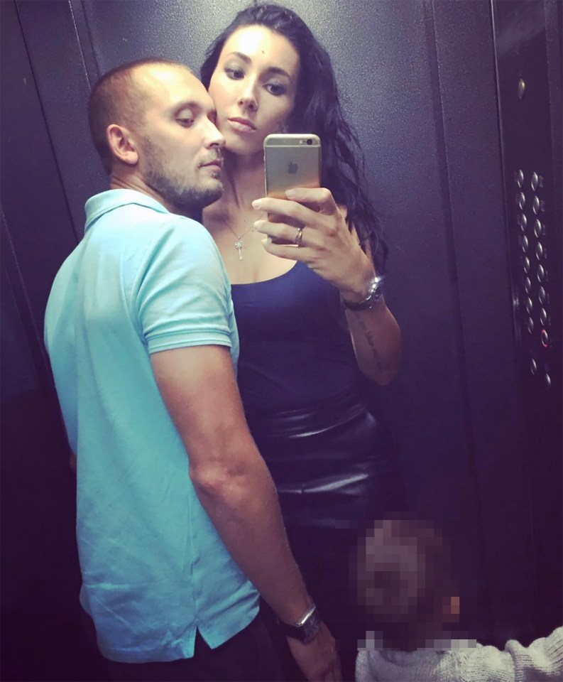 Selfie of a couple and their child in an elevator.
