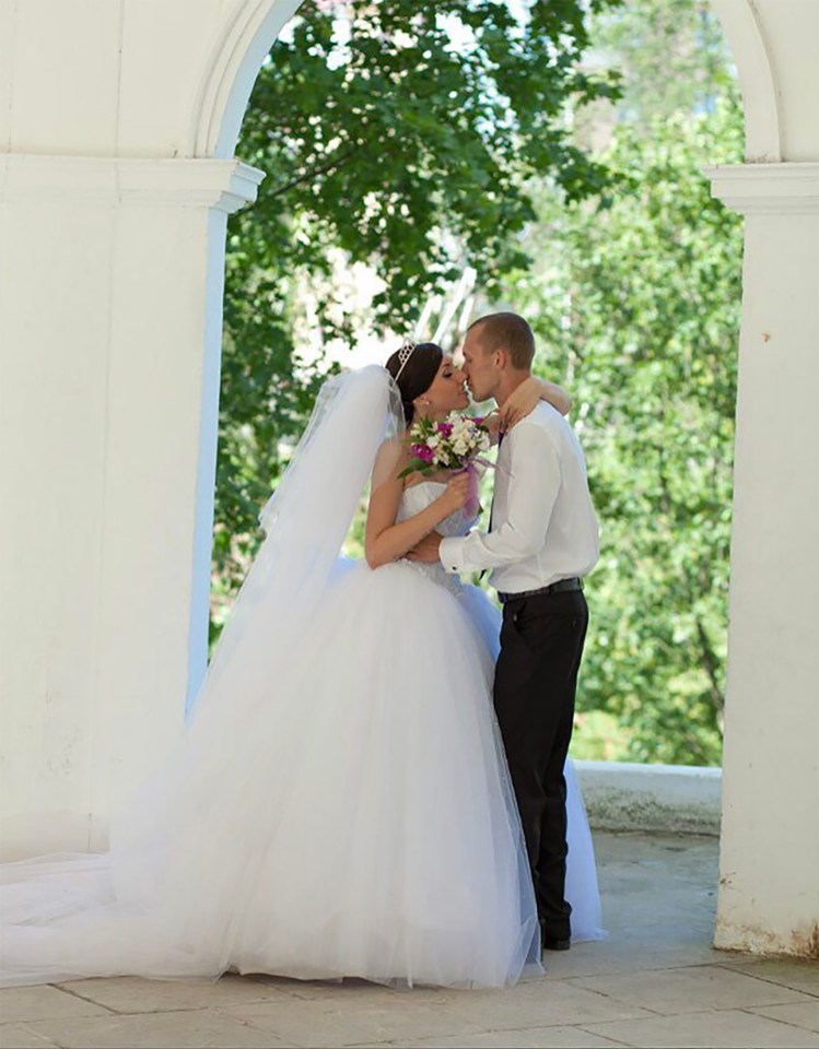 Bride and groom kissing.
