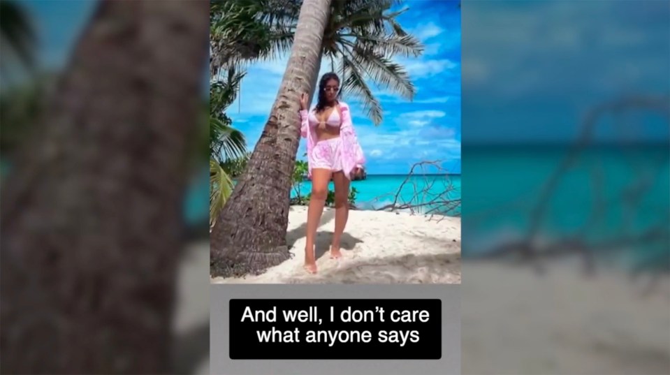 Woman in pink beachwear on a tropical beach.