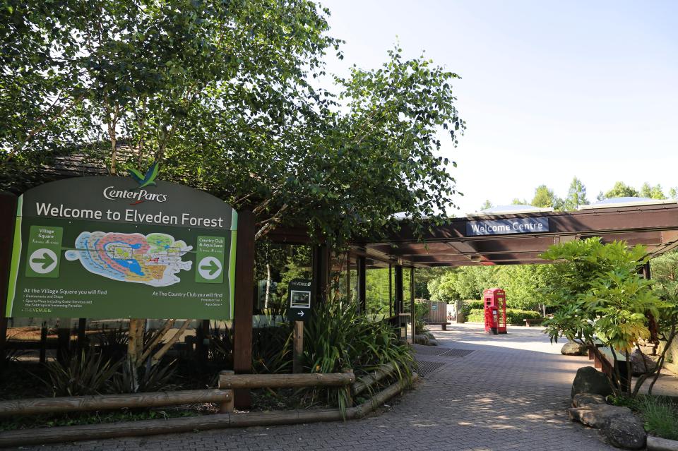 Center Parcs Elveden Forest welcome center sign with map and directions.