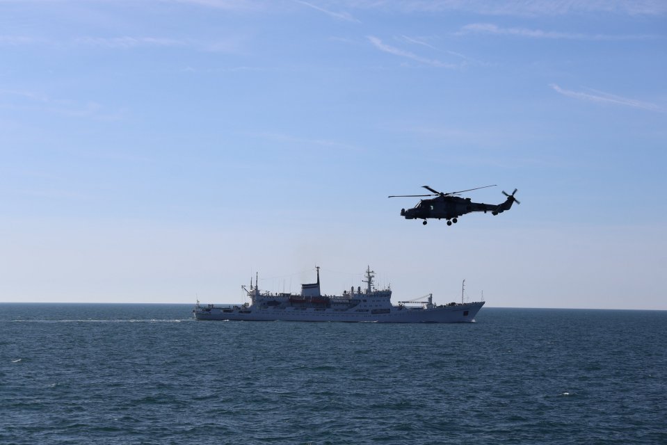A Wildcat helicopter shadowing a Russian survey ship at sea.