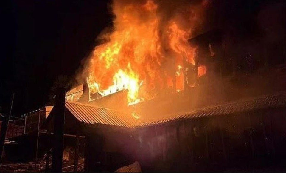 Hotel engulfed in flames.
