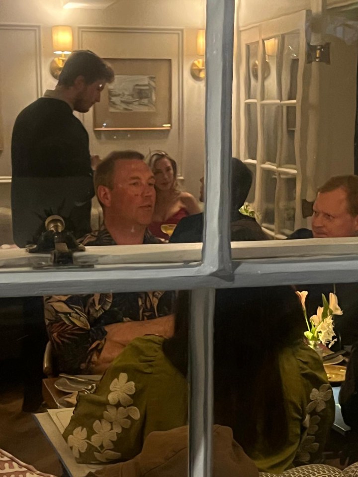 Photo of Zara McDermott and Louis Tomlinson dining at a restaurant.