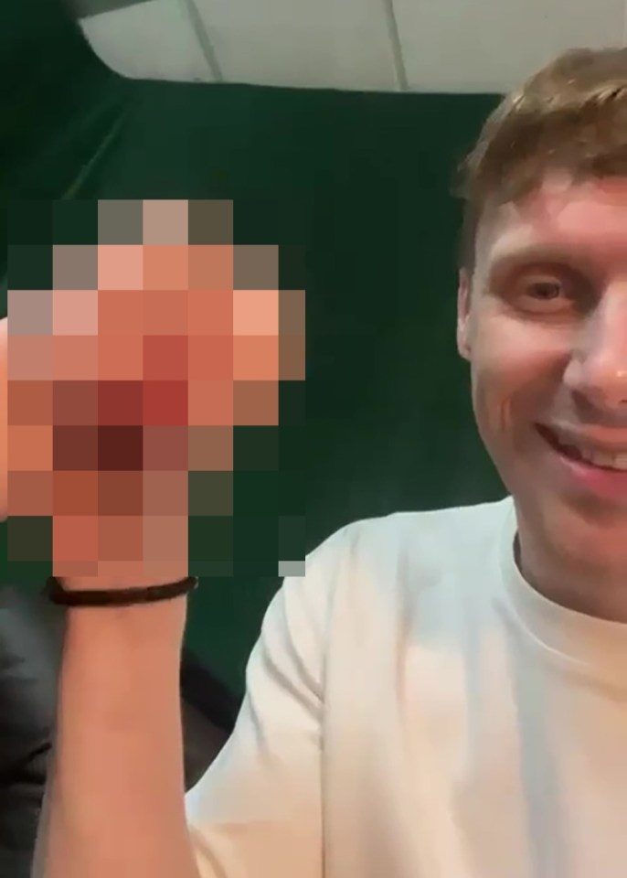 Pixilated image of a sex toy held by a man.