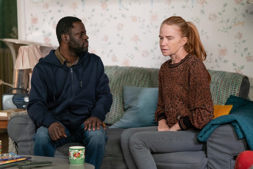 Kojo and Bianca sitting on a couch, talking.