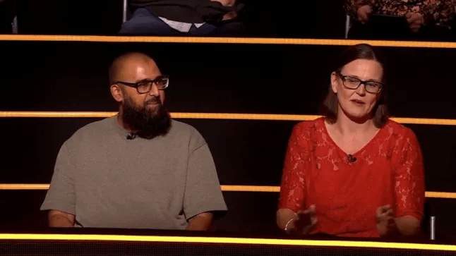 Heidi Phillips and a man on The 1% Club.