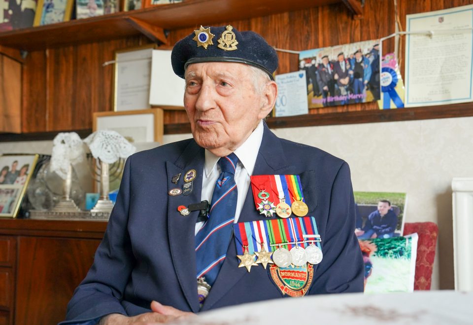 Veteran wearing medals and beret.
