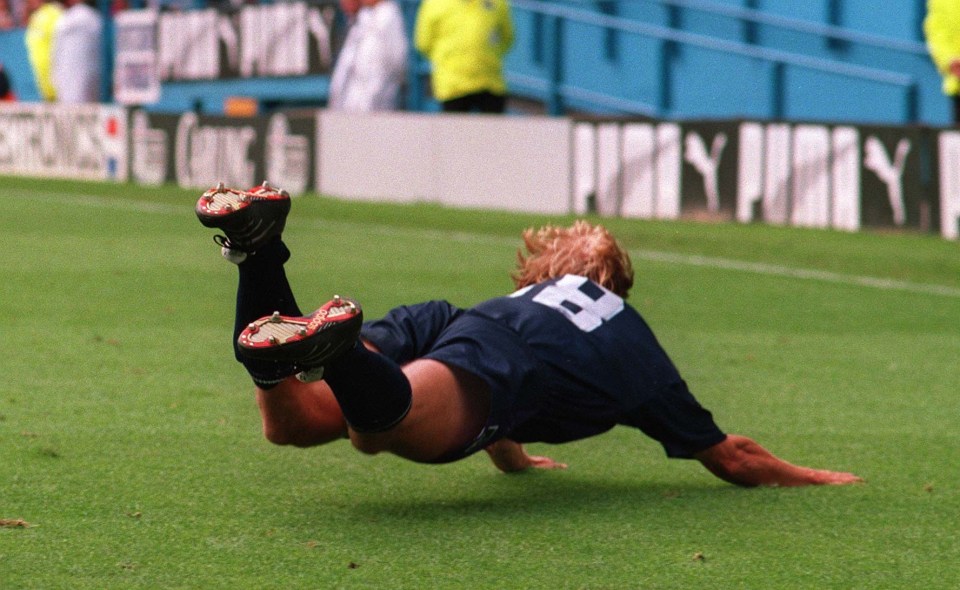 Jürgen Klinsmann celebrating after scoring his first goal for Tottenham.