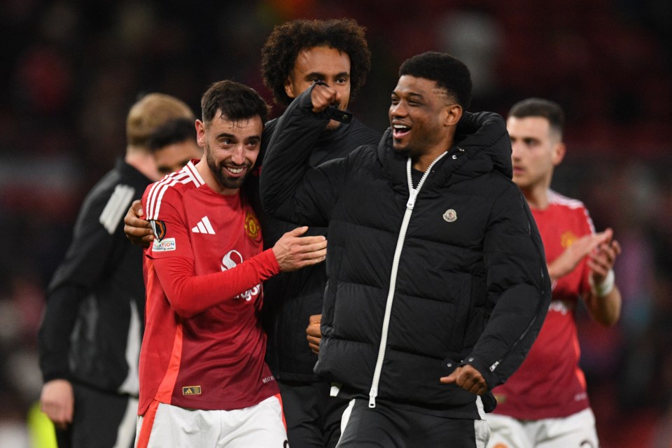 Manchester United's Bruno Fernandes and Amad Diallo celebrating after a soccer match.