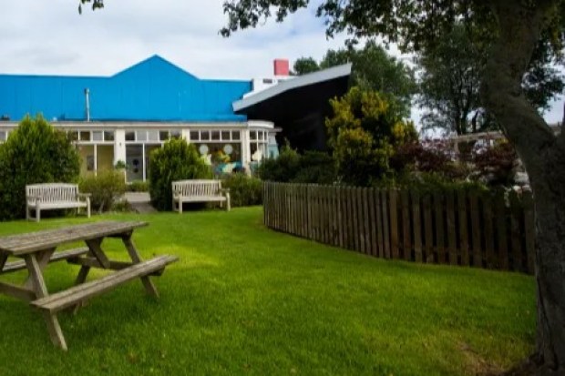 Pontins Pakefield holiday park with picnic tables and landscaping.
