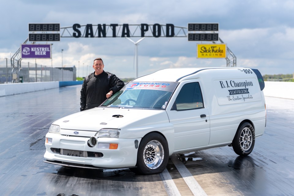 A modified Ford Escort van at Santa Pod Raceway, holding a speed record.