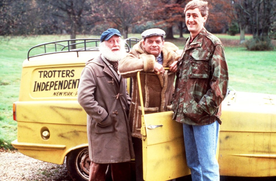 Photo of the cast of Only Fools and Horses standing by their yellow van.