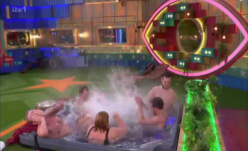 Several people splashing in a hot tub.
