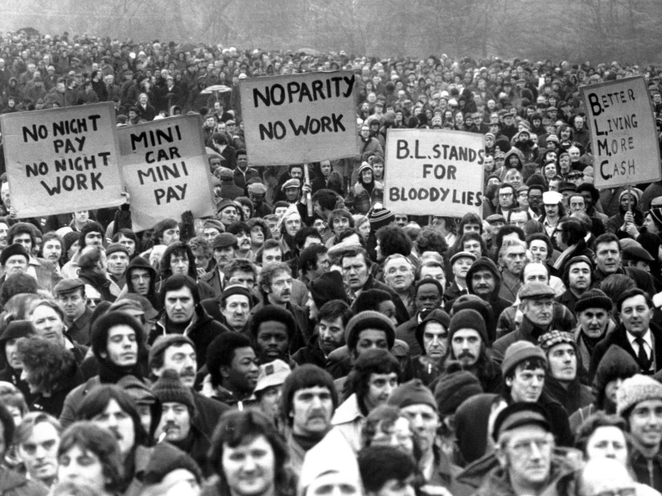 British Leyland workers striking in Birmingham, holding signs protesting low pay.