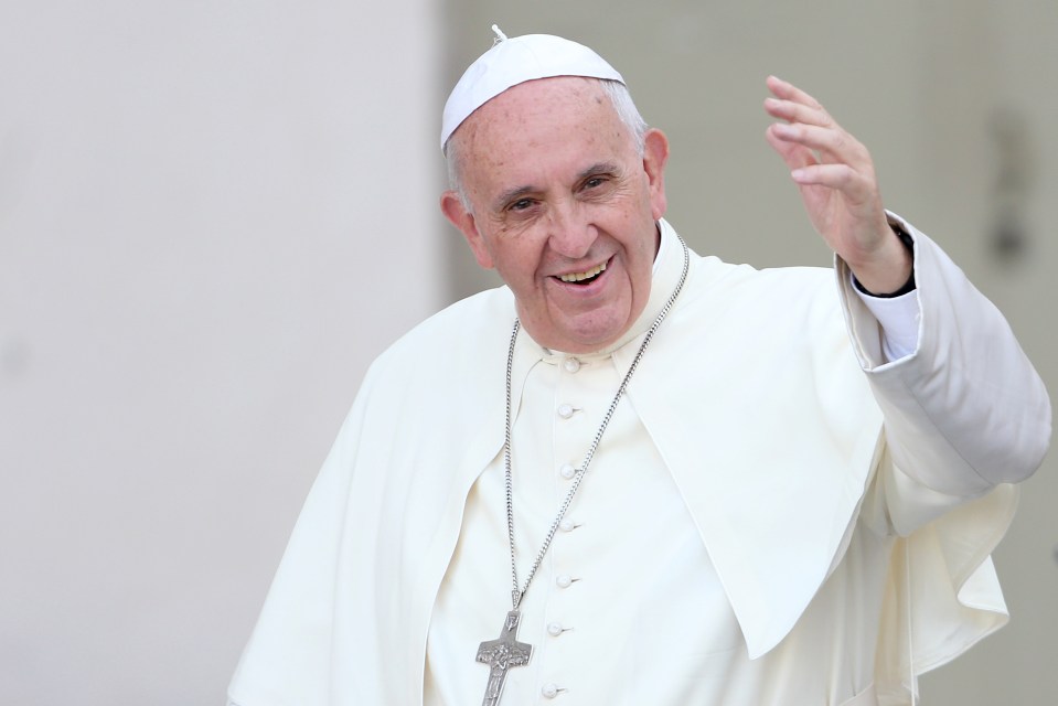 Pope Francis waving to the crowd.